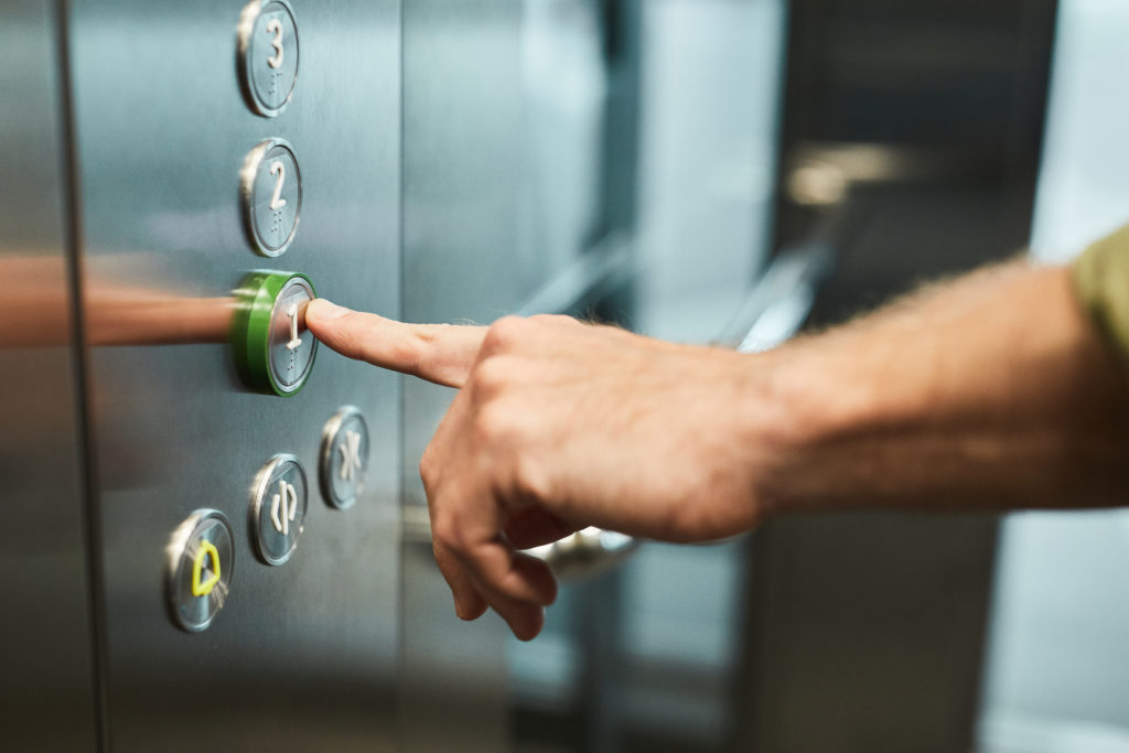 image of a person controlling an elevator